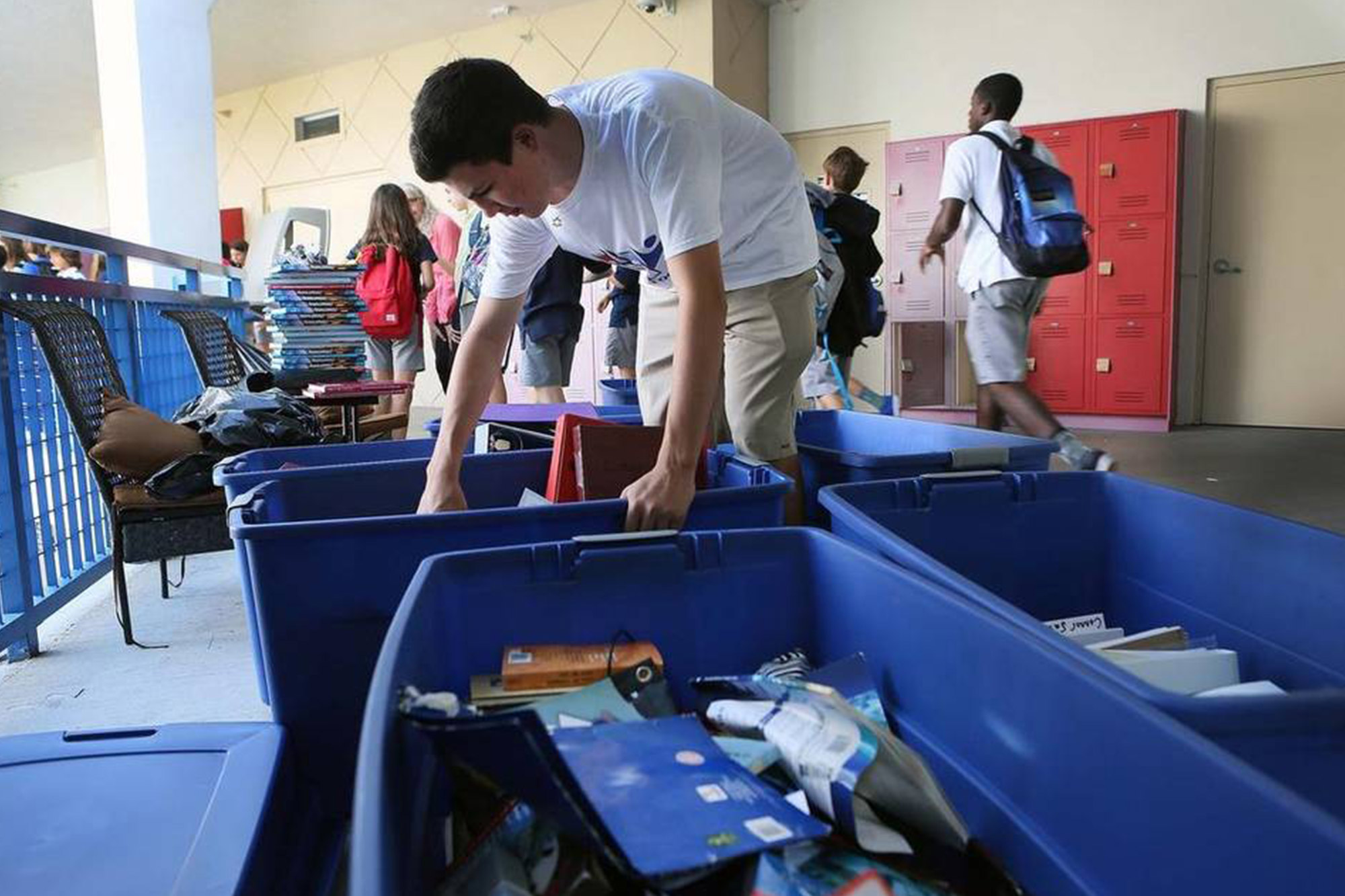 a student cleans out his locker