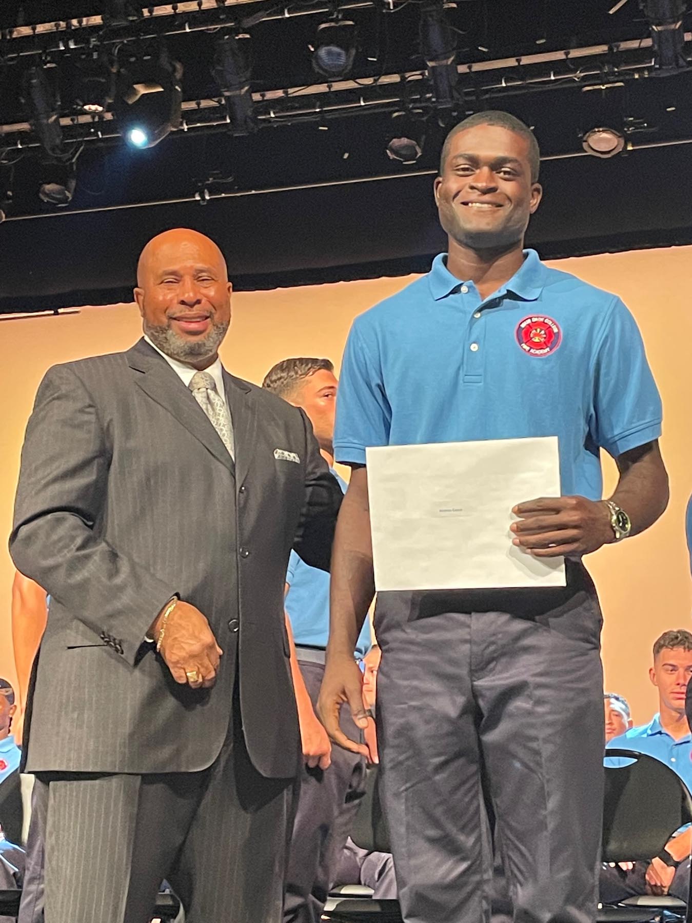 Jacaree Eason receives his diploma after successfully completing Miami-Dade College’s Fire Academy.