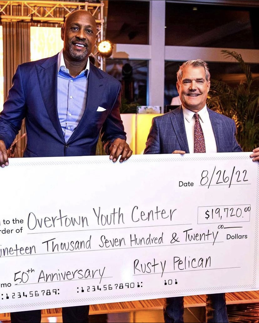 Rusty Pelican presents a check to OYC
