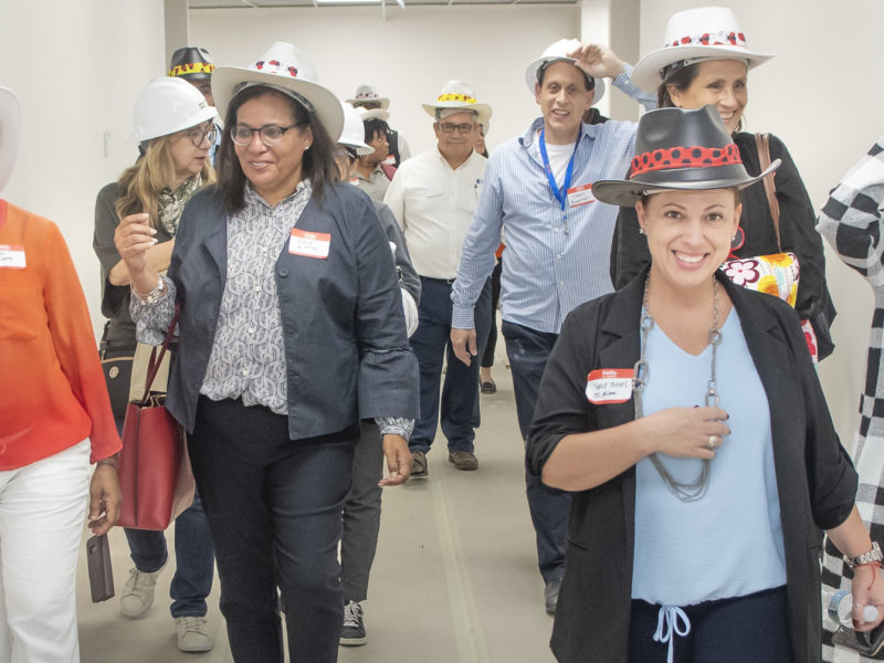 Staff and guests of OYC tour the new facility