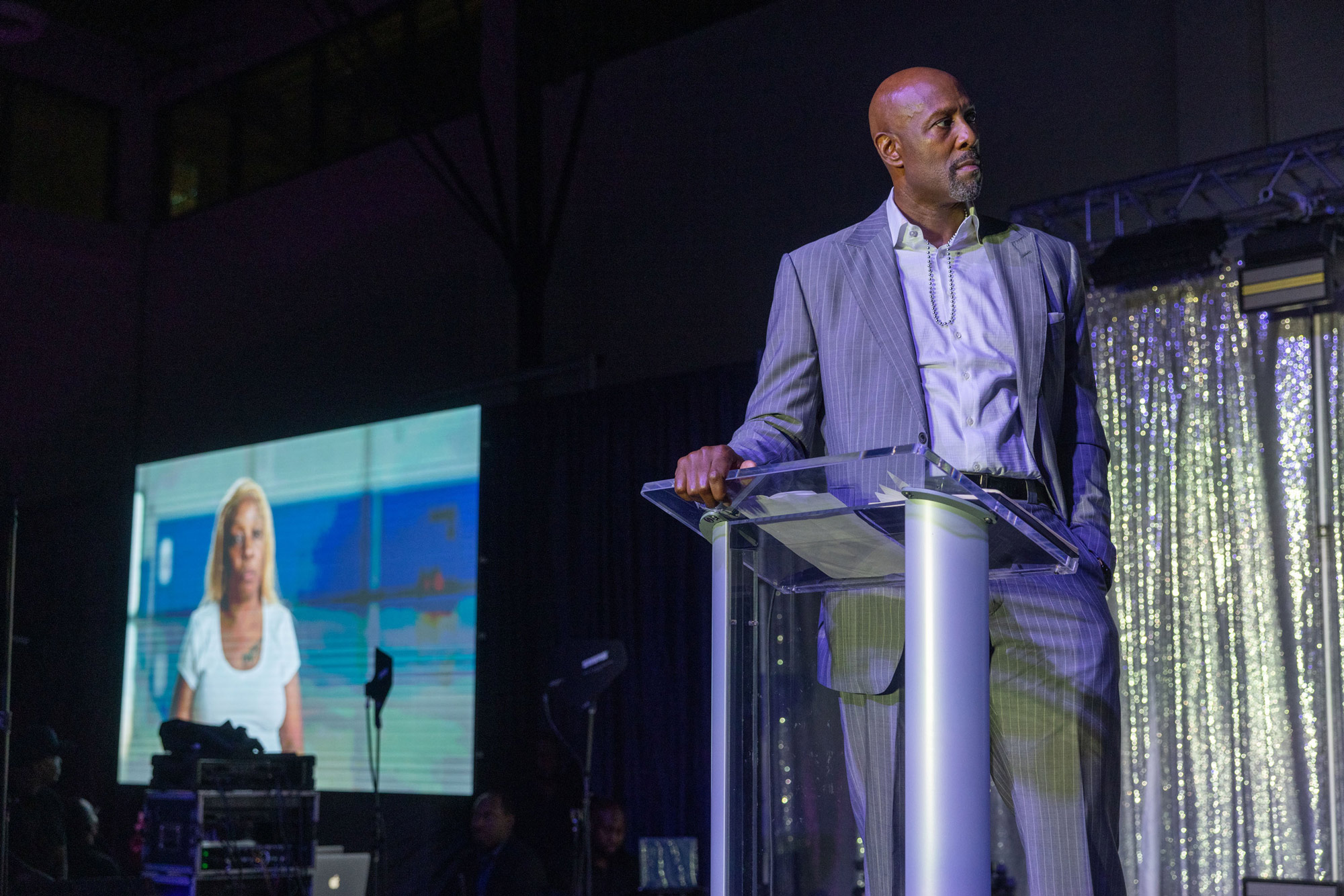 Alonzo Mourning on stage at the OYC Miami grand opening event